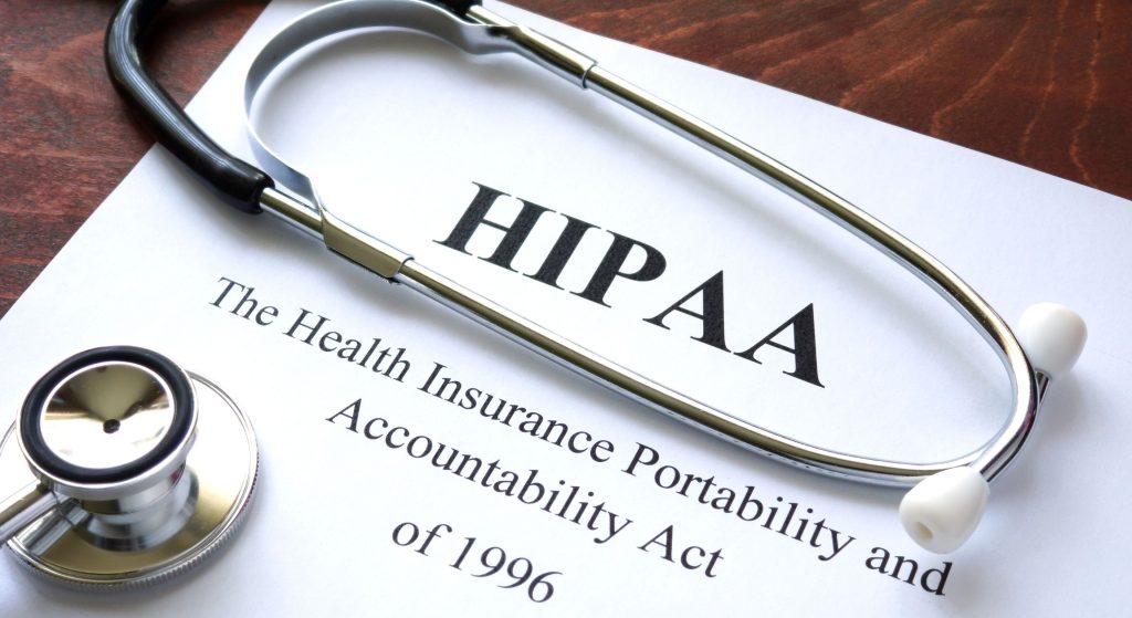 Stethoscope lying across a HIPAA document titled Health Insurance Portability and Accountability Act.